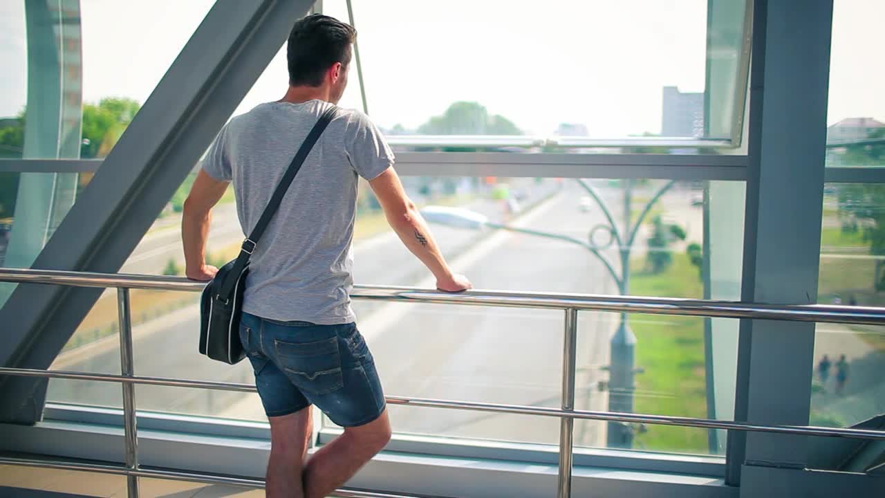Stock Video Man Looking Out The Window Of A Bridg Animated Wallpaper