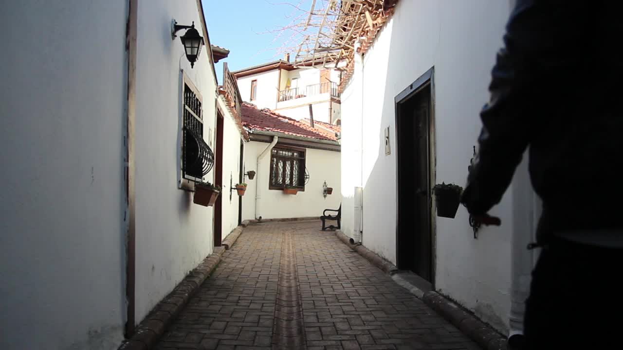 Stock Video Man Looking For An Address In An Old Alle Animated Wallpaper