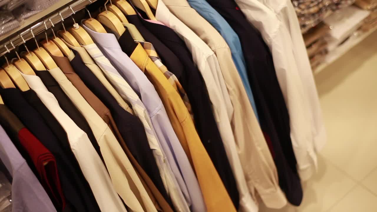 Stock Video Man Looking For A Shirt In A Clothing Sho Animated Wallpaper
