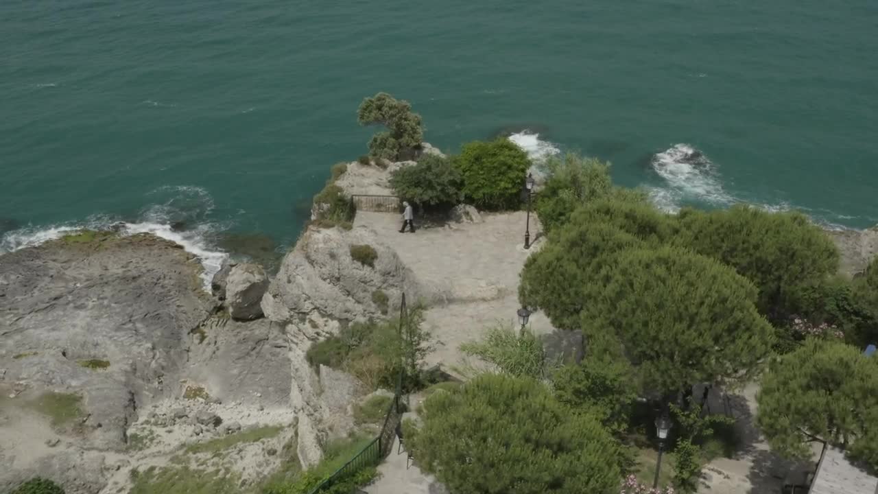 Stock Video Man Looking Down Over Cliff Animated Wallpaper