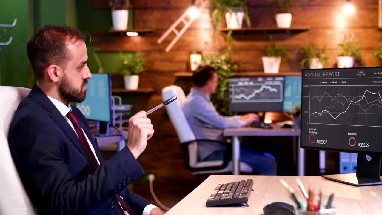 Stock Video Man Looking At Monitor Animated Wallpaper