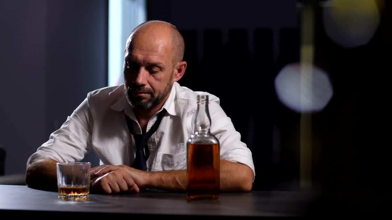 Stock Video Man Looking At A Whisky Glas Animated Wallpaper