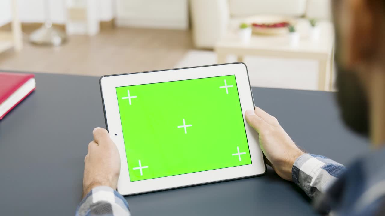 Stock Video Man Looking At A Tablet With Green Scree Animated Wallpaper