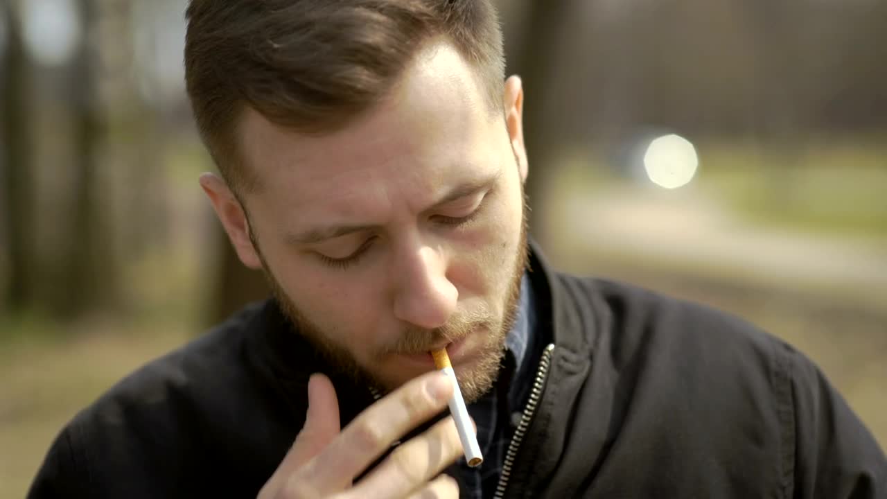 Stock Video Man Lits A Cigarett Animated Wallpaper
