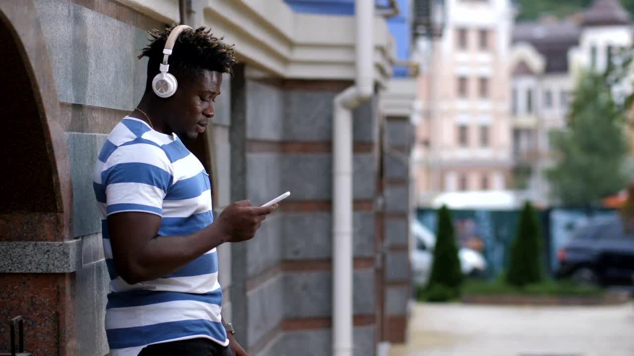 Stock Video Man Listening To Music On His Phon Animated Wallpaper