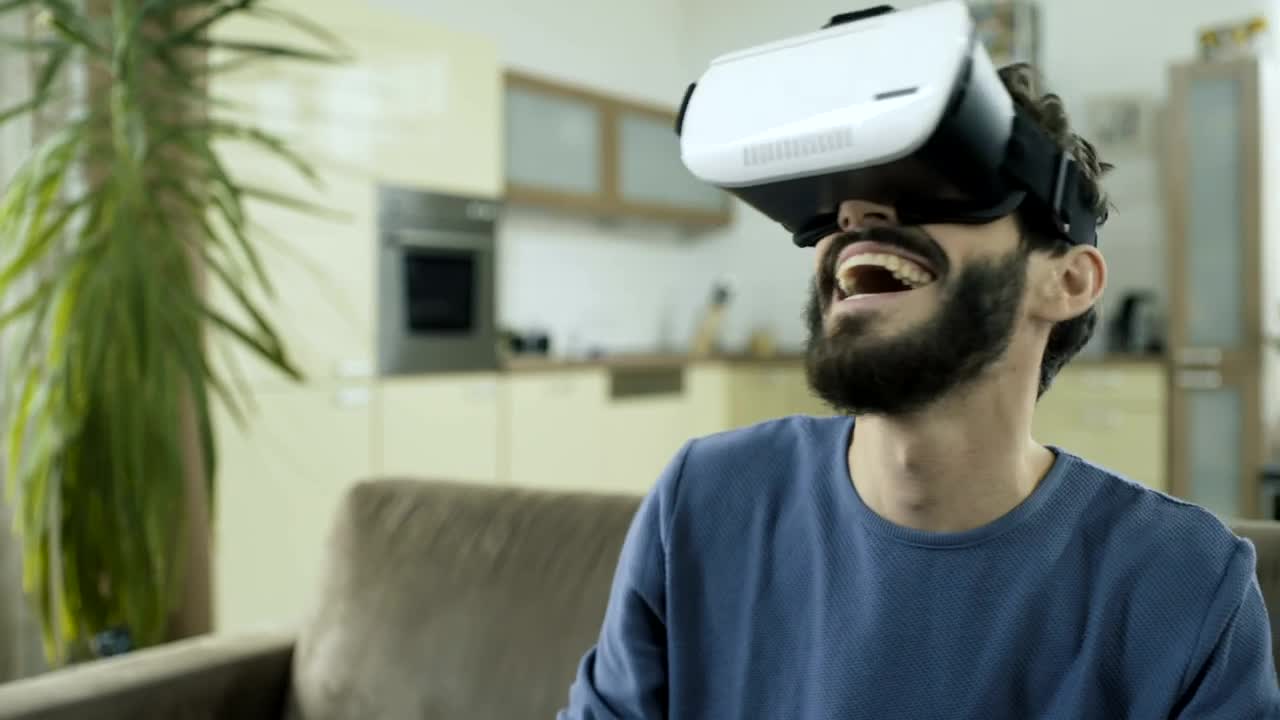 Stock Video Man Laughing Hysterically With Virtual Realit Animated Wallpaper
