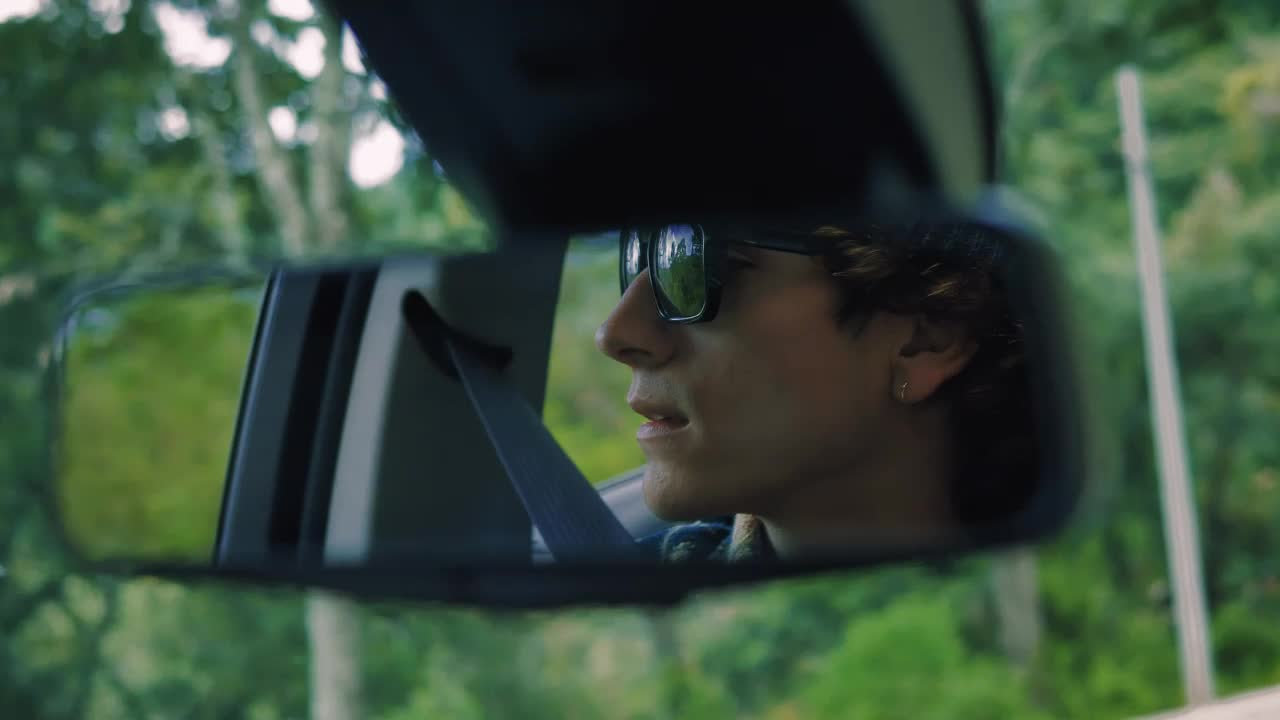 Stock Video Man In The Rear View Mirror Traveling Through A Fores Animated Wallpaper