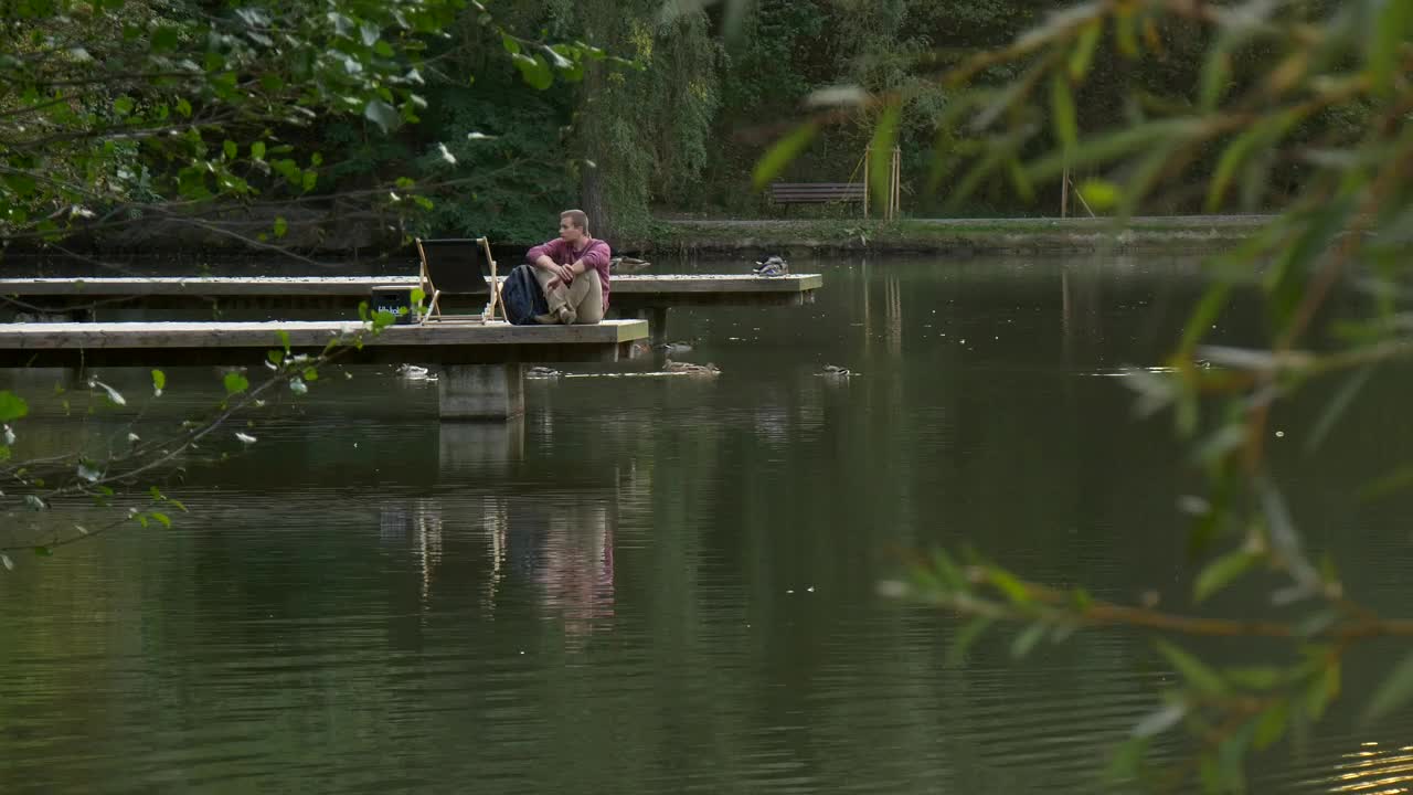Stock Video Man In The Lake Dock Walks Awa Animated Wallpaper