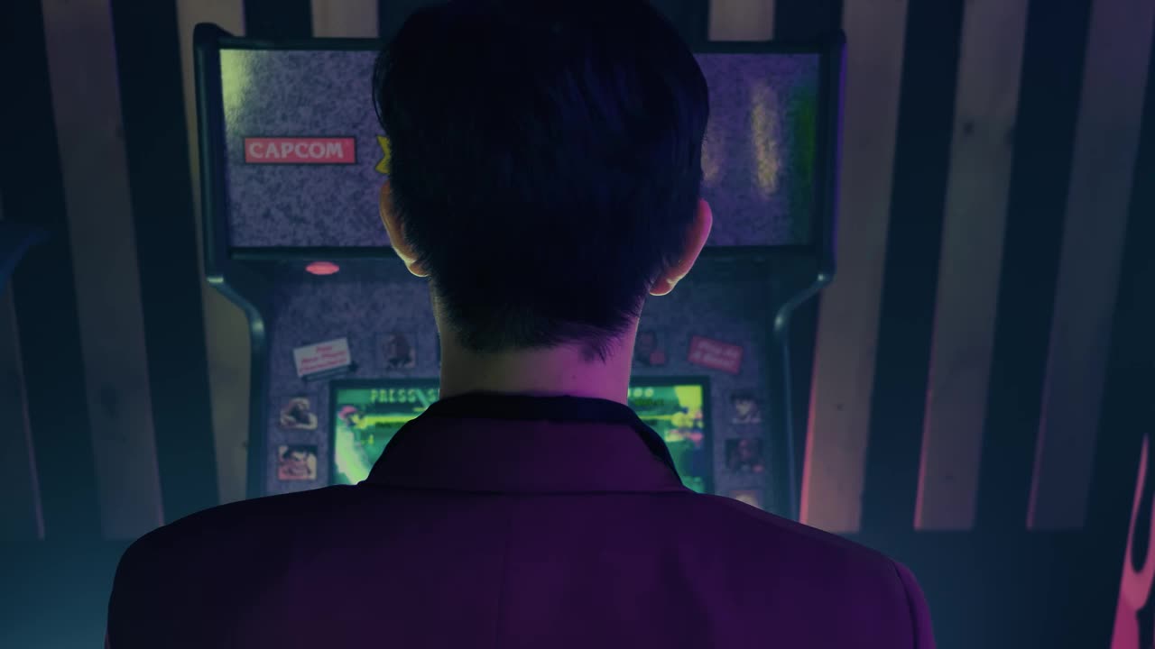 Stock Video Man In Suit Playing On Arcade Machin Animated Wallpaper