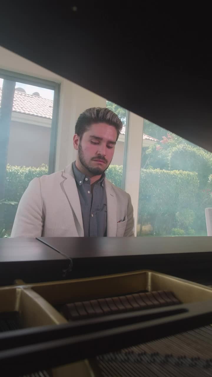 Stock Video Man In Suit Playing A Grand Pian Animated Wallpaper