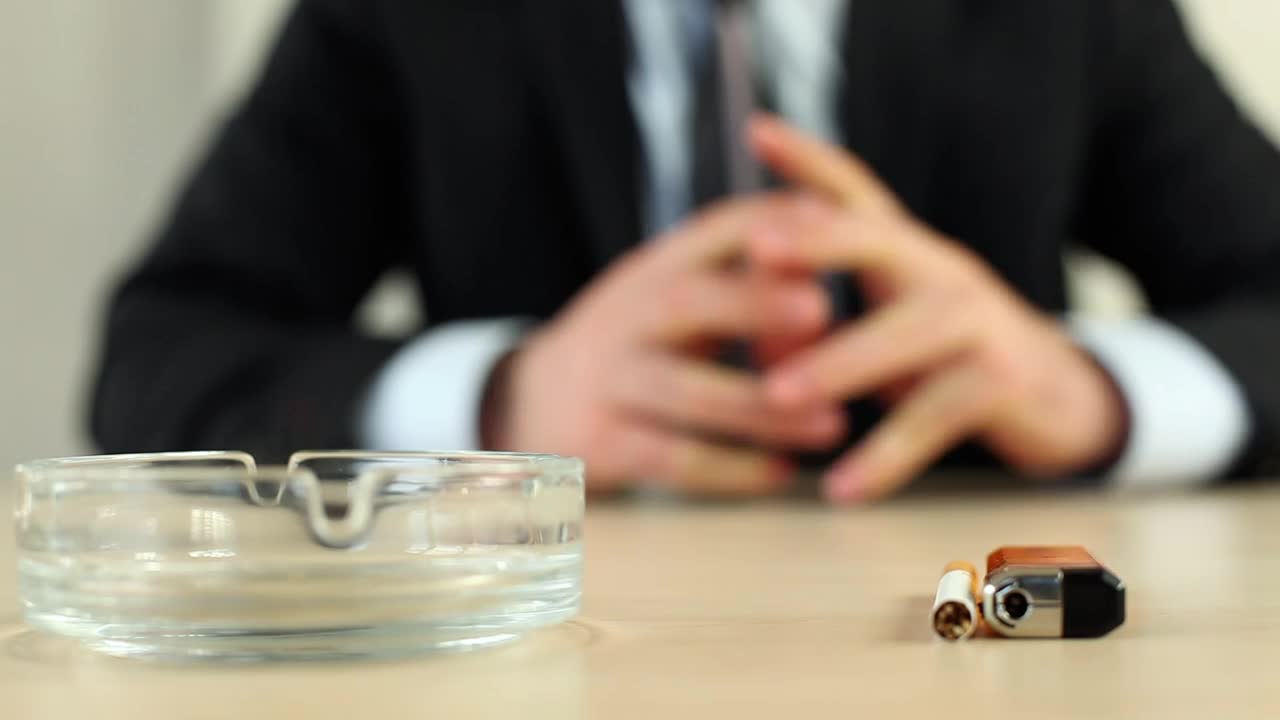 Stock Video Man In Suit Lights A Cigarette And Starts Smokin Animated Wallpaper