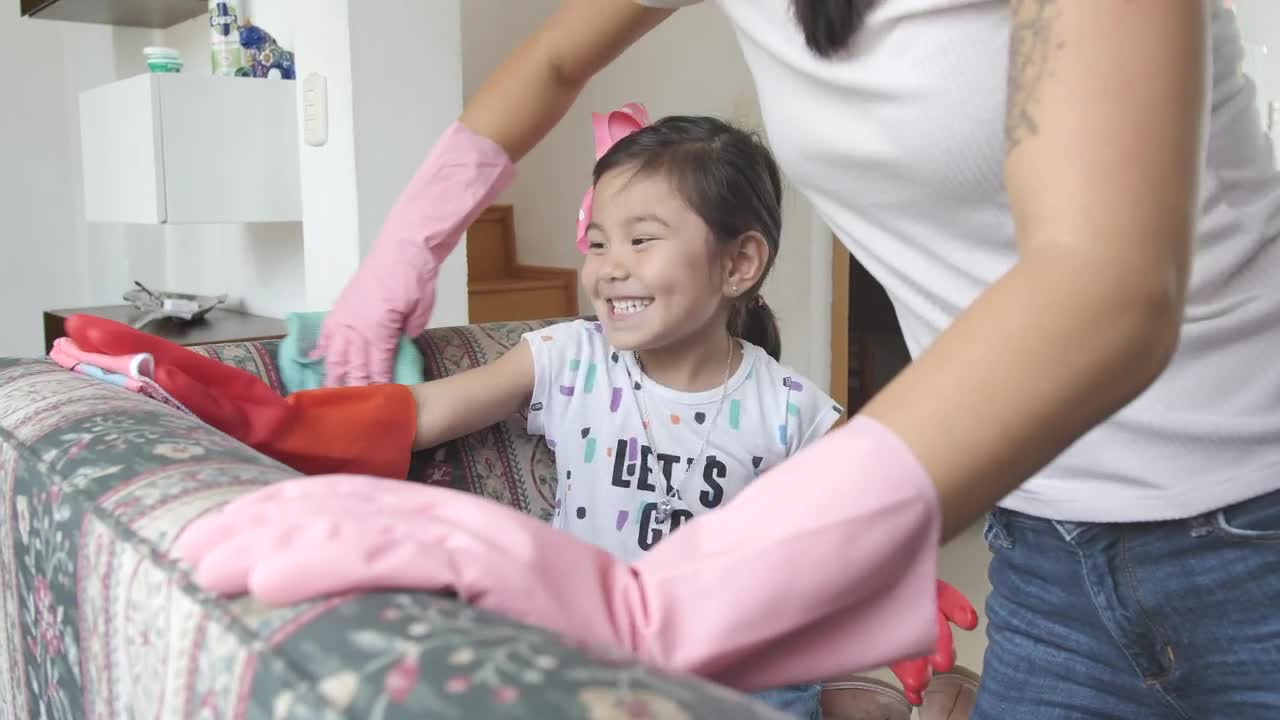 Stock Video Mother With Her Little Daughter Cleaning An Armchair Live Wallpaper