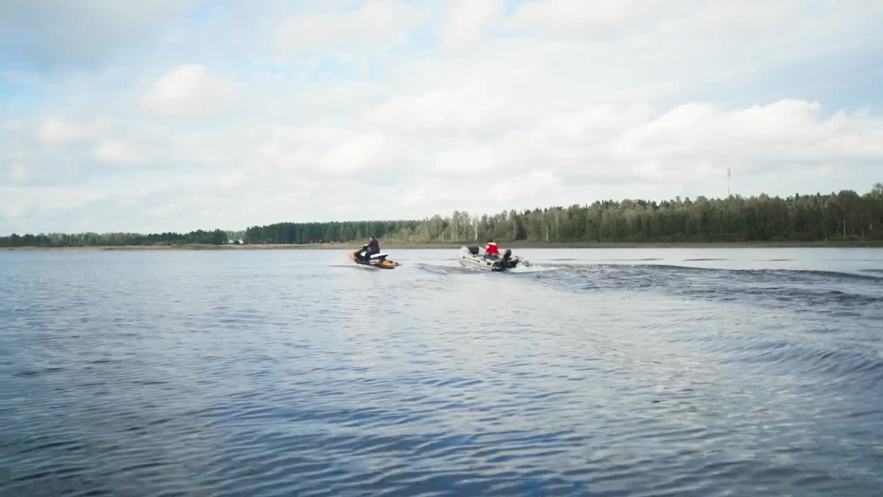 Stock Video Motorboat And Jet Ski Sailing On A Lake Live Wallpaper