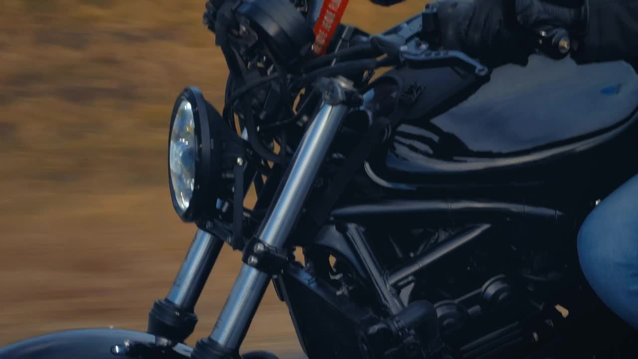 Stock Video Motorcycle And Its Driver Speeding Down A Road Live Wallpaper