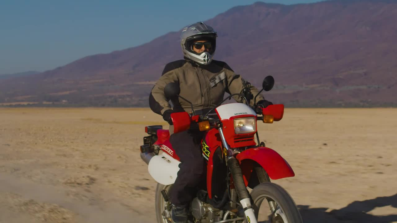 Stock Video Motorcyclist In The Arid Desert Live Wallpaper