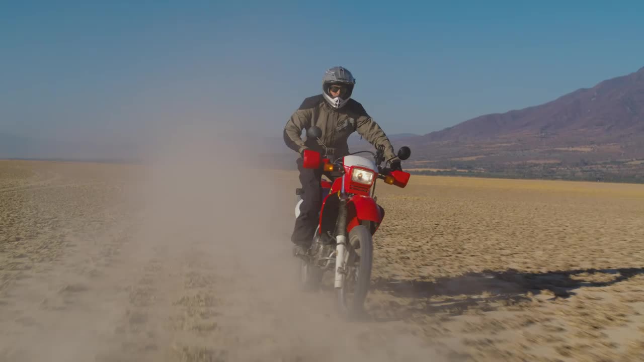 Stock Video Motorcyclist On A Red Motorcycle In The Desert Live Wallpaper