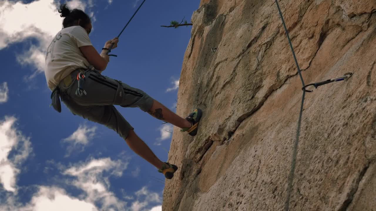 Stock Video Mountaineer Coming Down From A Mountain With A Rope Live Wallpaper