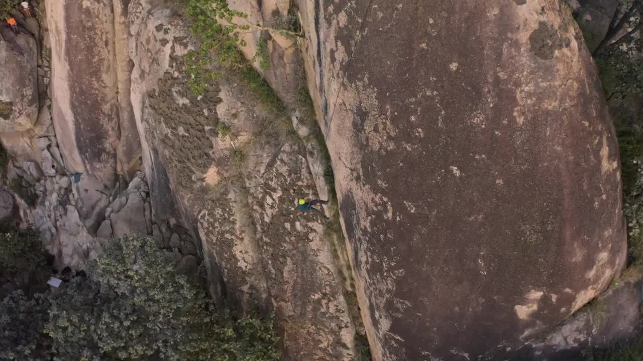 Stock Video Mountaineer Descending A Huge Mountain Seen From The Air Live Wallpaper