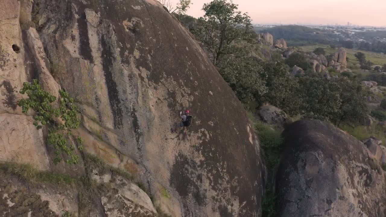 Stock Video Mountaineer Going Down A Mountain Live Wallpaper