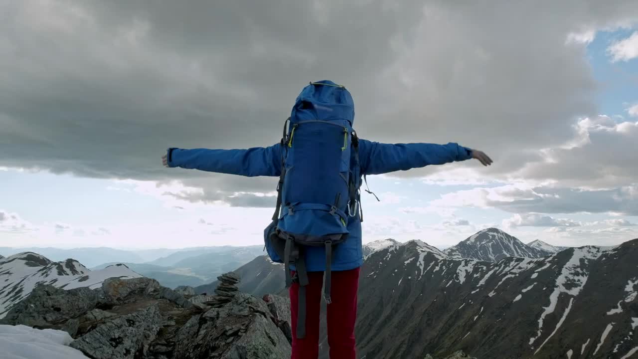 Stock Video Mountaineer Raising Hands On Top Of A Mountain Live Wallpaper