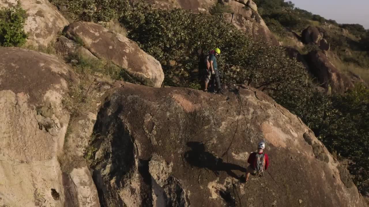 Stock Video Mountaineers Descending A Mountain Viewed From Above Live Wallpaper