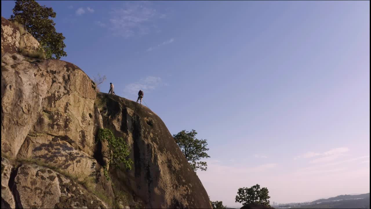 Stock Video Mountaineers On Top Of A Mountain Seen From The Air Live Wallpaper