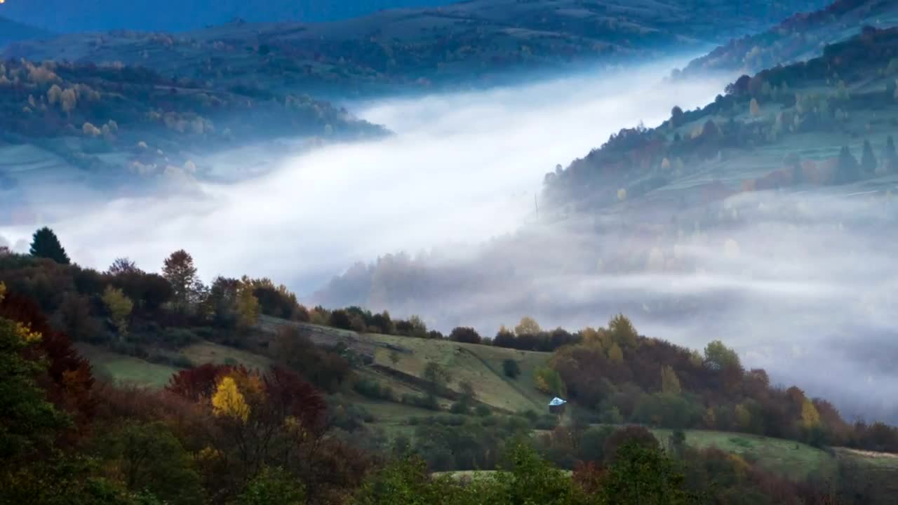 Stock Video Mountainous Valley With Fog During Sunrise Live Wallpaper
