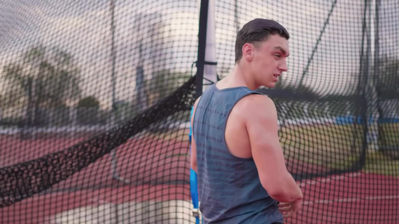 Stock Video Muscular Man Takes Off His Shirt During Exercise Live Wallpaper