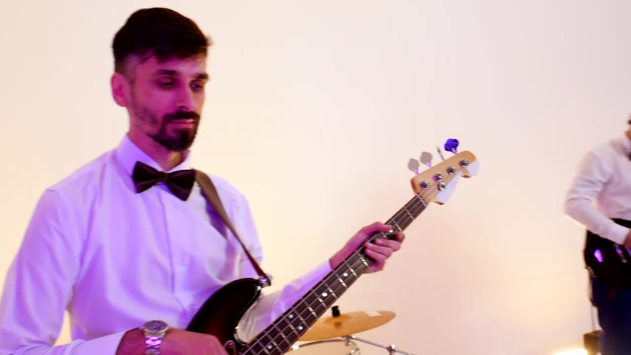 Stock Video Musical Band Performing A Song In A Bright Studio Live Wallpaper