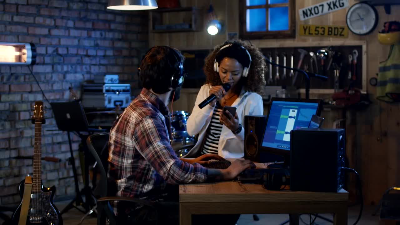 Stock Video Musicians Recording Voice In A Home Studio Live Wallpaper