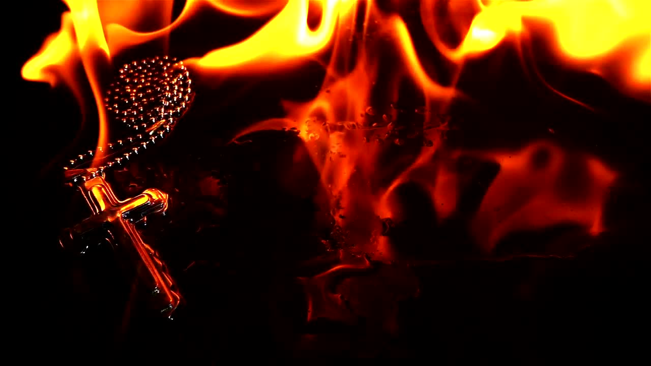 Stock Video Necklace Of A Burning Crucifix Close Up Live Wallpaper