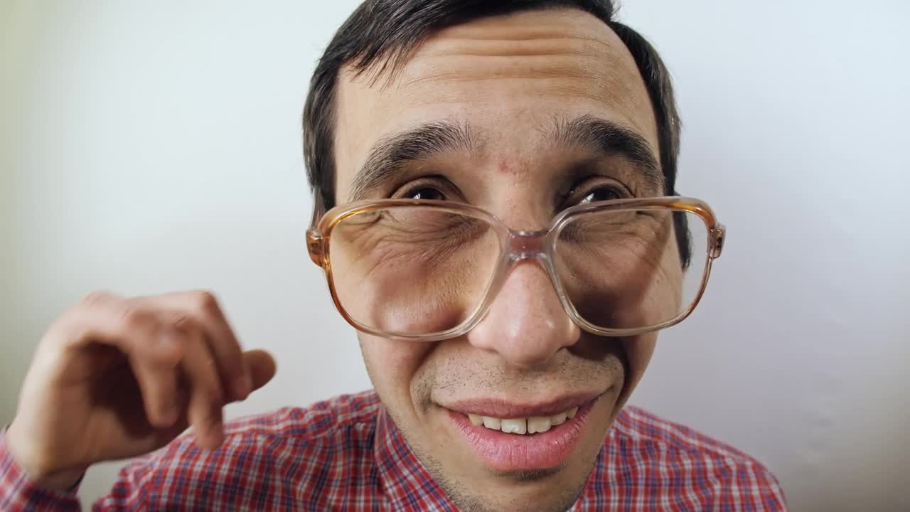 Stock Video Nerd Scratches His Ear Portrait Live Wallpaper