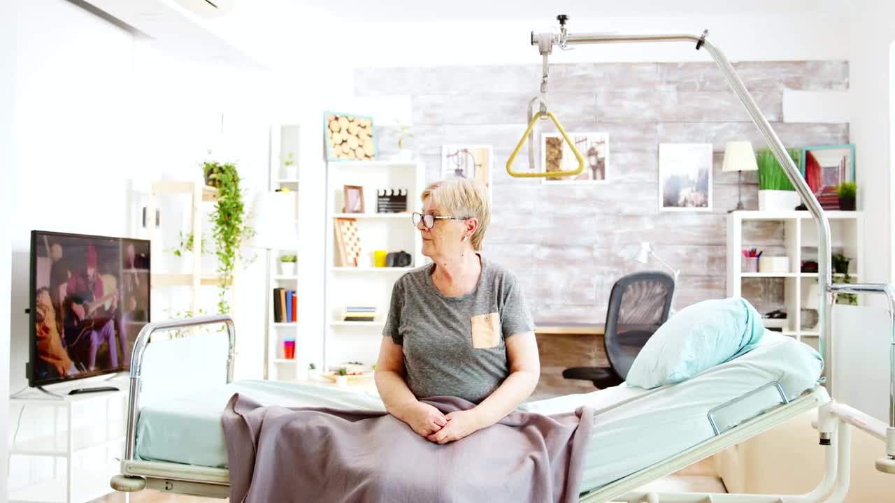 Stock Video Nurse Helping Elderly Woman With Crutches Live Wallpaper