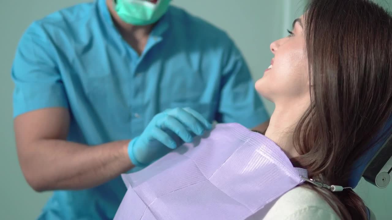 Stock Video Nurse In Face Mask Prepares Patient For Exam Live Wallpaper