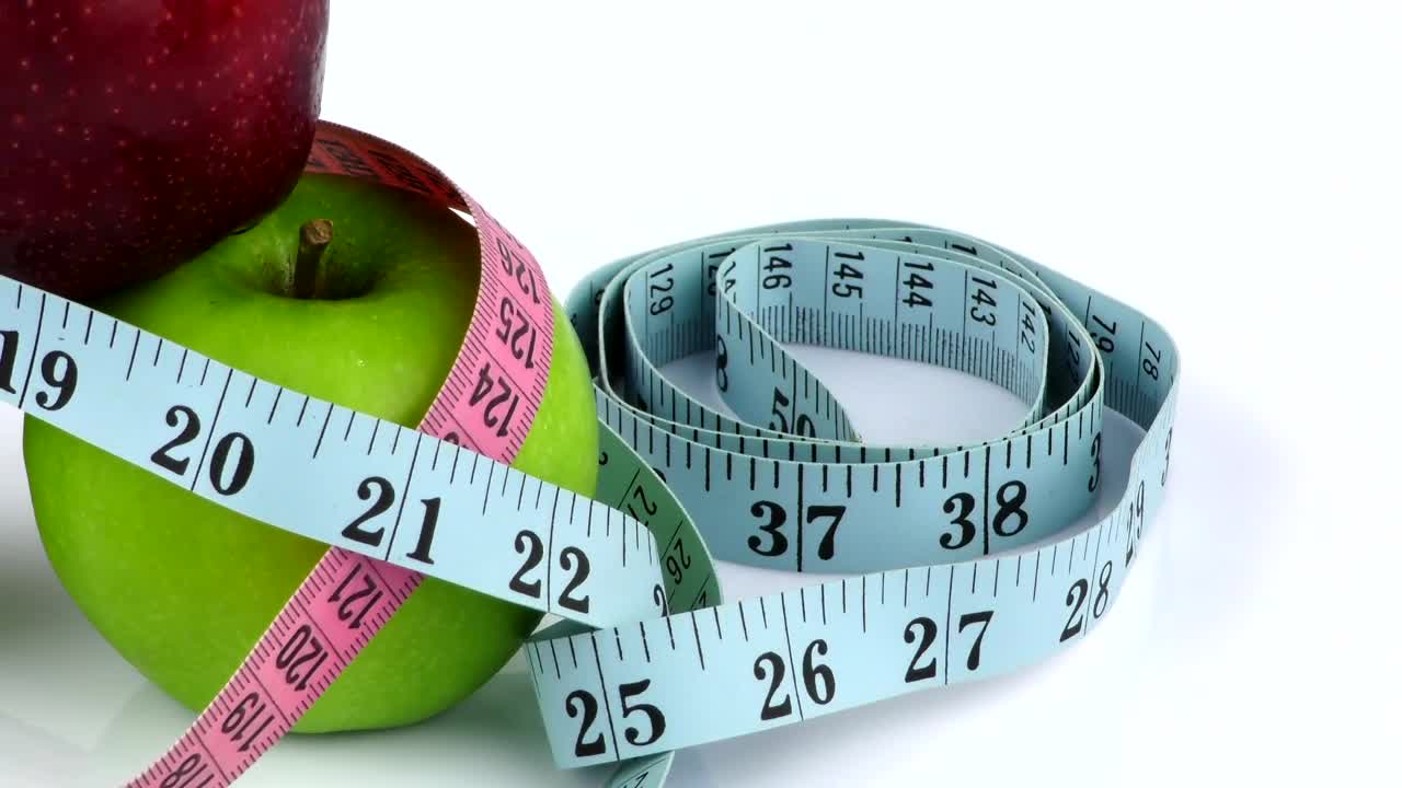 Stock Video Nutritionist Measuring Tapes And Apples Live Wallpaper