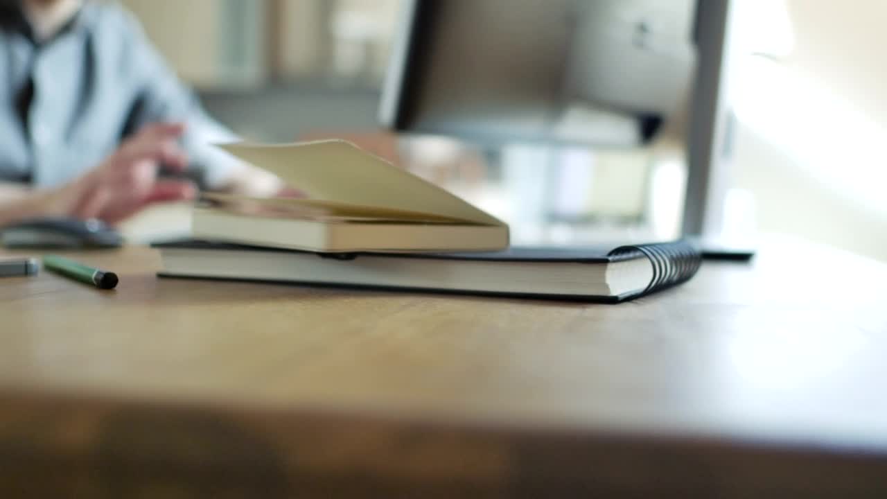 Stock Video Office Objects And A Man Working In The Background Live Wallpaper