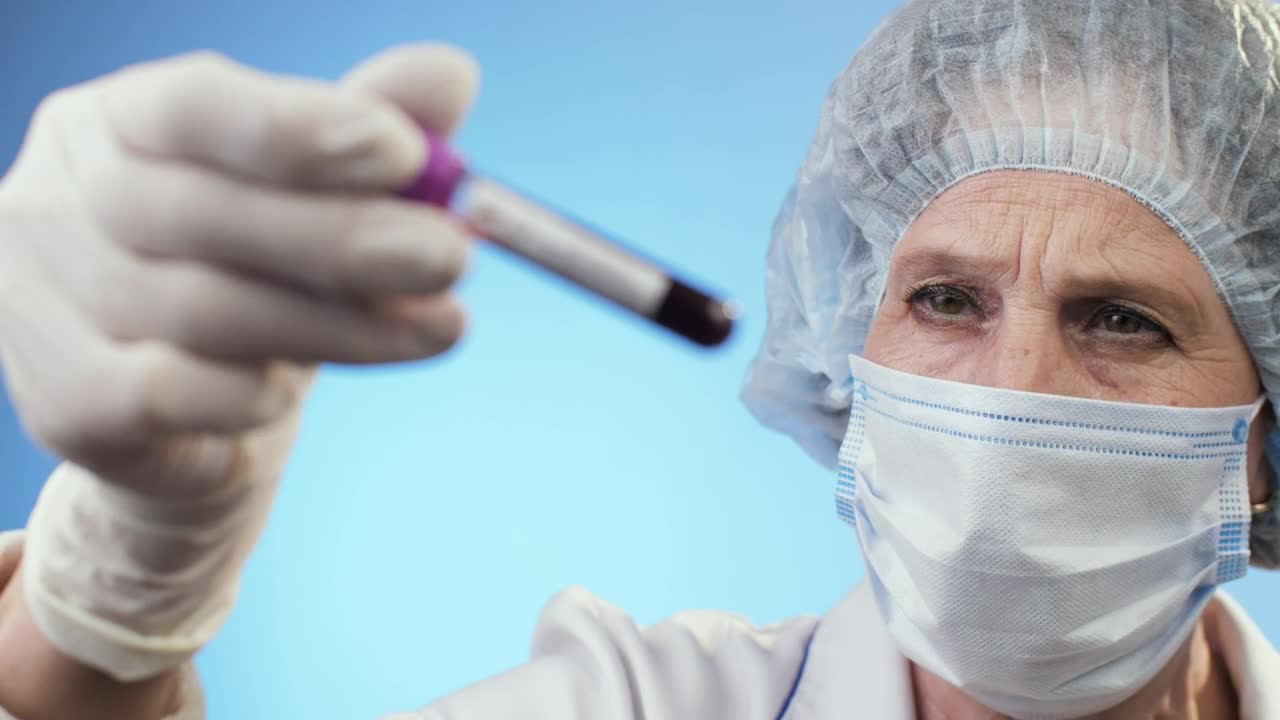 Stock Video Old Doctor Checking Positive Test For Covid Live Wallpaper