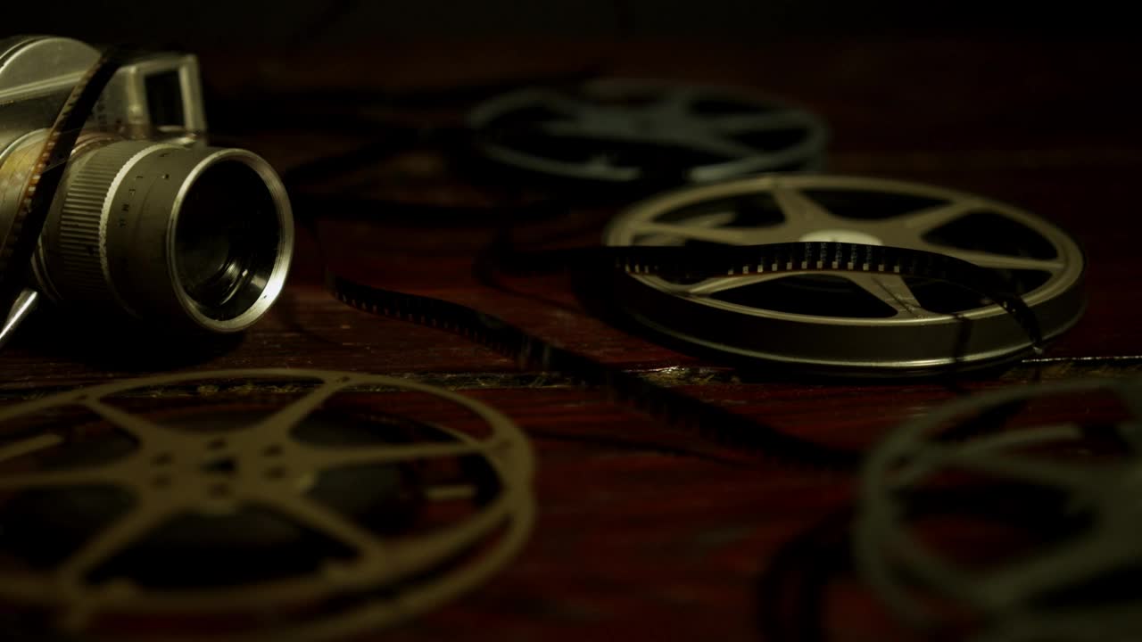 Stock Video Old Film Cartridges And Vintage Projector Live Wallpaper