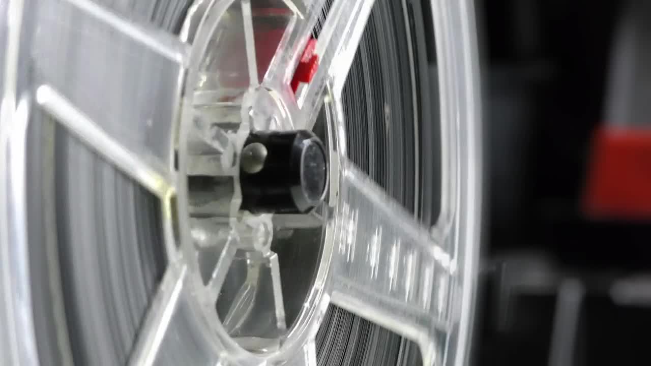 Stock Video Old Film Spinning While Playing Live Wallpaper