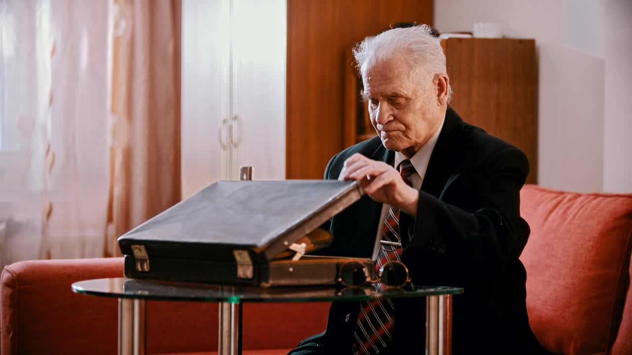 Stock Video Old Gangster Taking A Gun Out Of A Briefcase Live Wallpaper