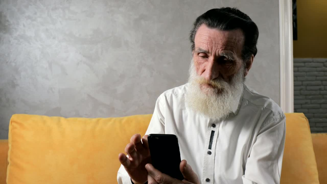 Stock Video Old Man Taking Successfully Takes Selfie With Mobile Phone Live Wallpaper
