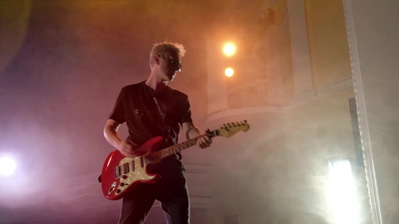 Stock Video Old Musician Playing The Guitar On A Stage Live Wallpaper