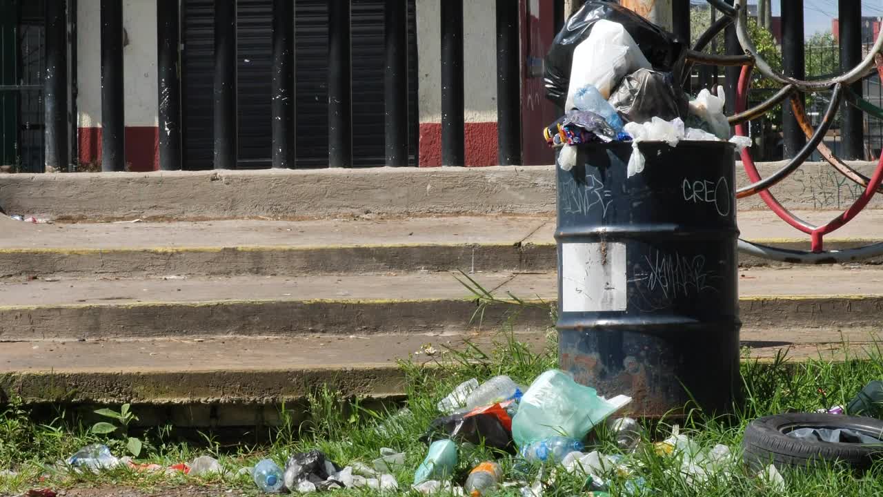 Stock Video Old Rusty Can Full Of Garbage On The Street Live Wallpaper