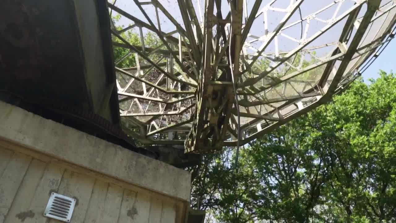 Stock Video Old Satellite Dish Seen From Below Surrounded By Trees Live Wallpaper