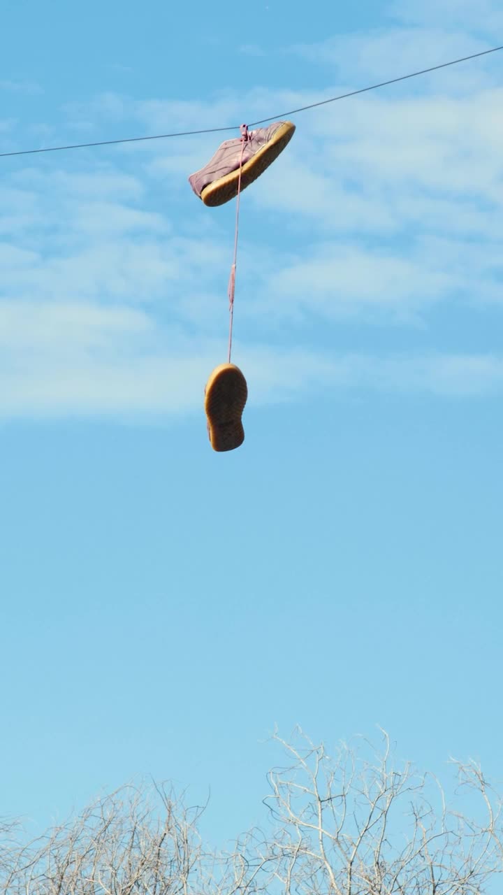 Stock Video Old Shoes Hanging On An Electric Wire Live Wallpaper