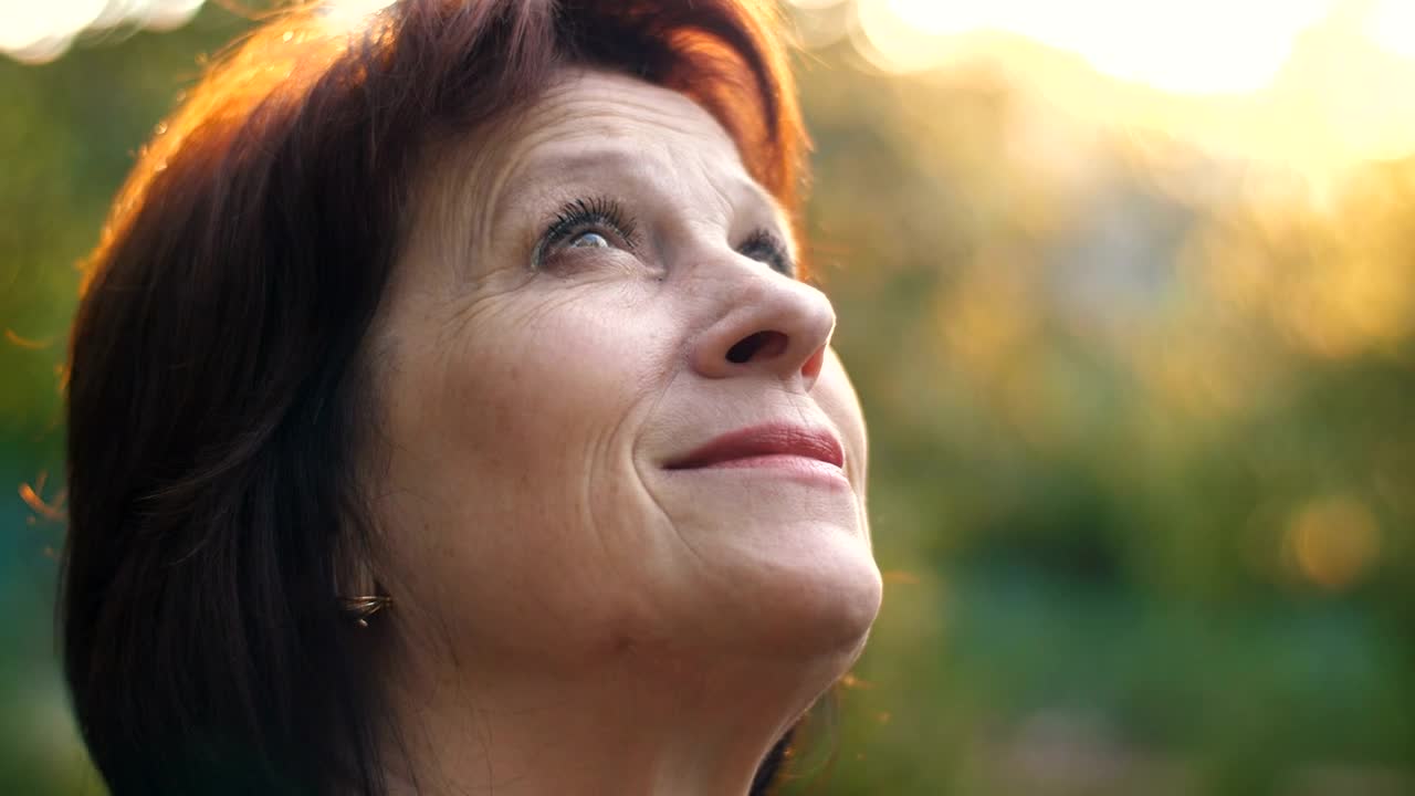 Stock Video Old Woman Looking At The Sky With Great Faith Live Wallpaper