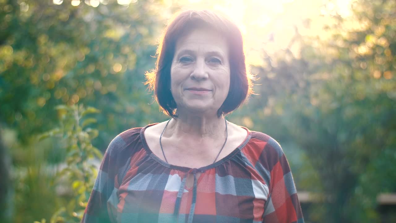 Stock Video Old Woman In Nature Portrait Live Wallpaper