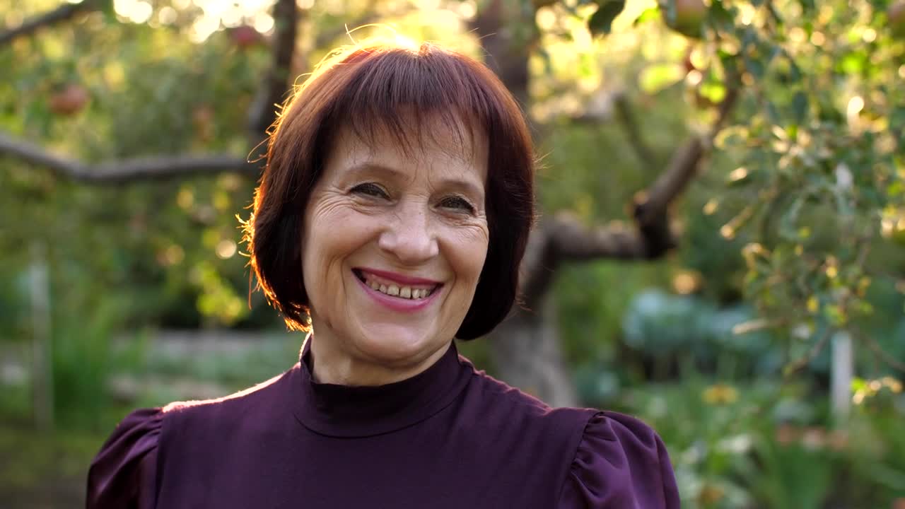 Stock Video Old Woman Smiling At Camera At A Garden Portrait Live Wallpaper