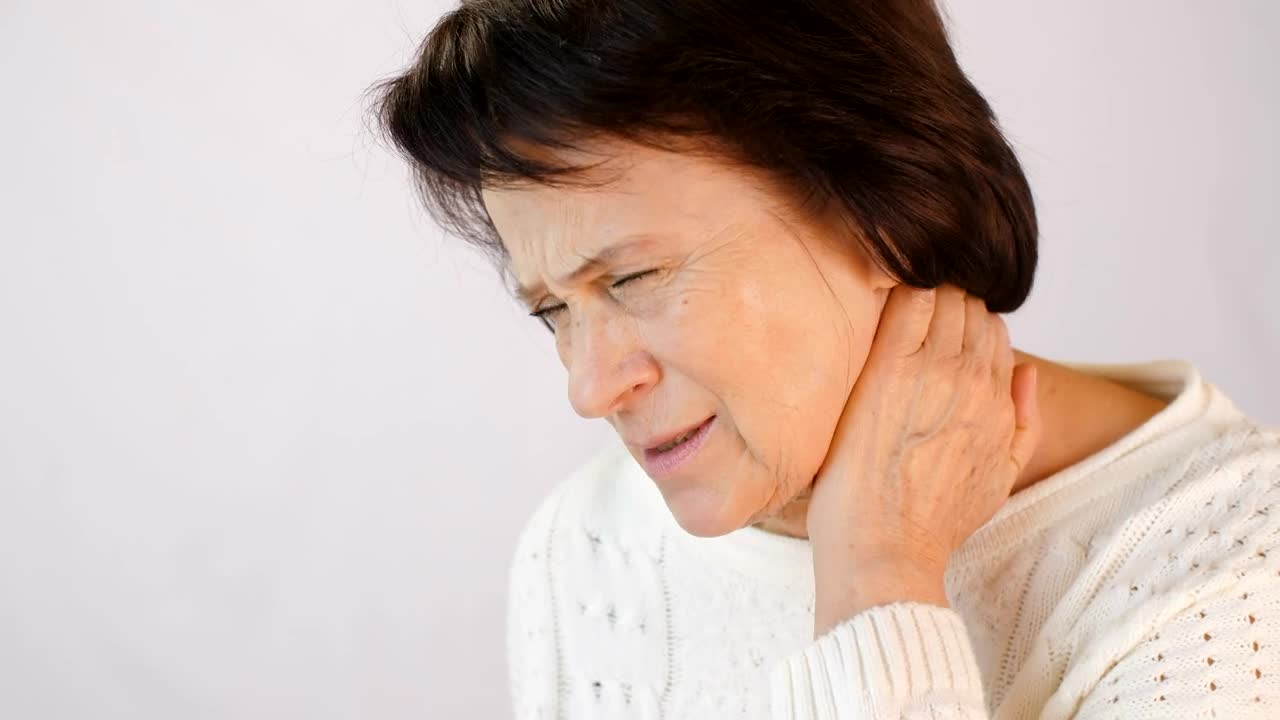 Stock Video Old Woman Sore Her Neck From Tension Live Wallpaper