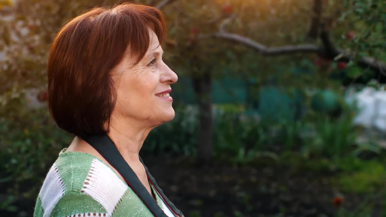 Stock Video Old Woman Taking Photos With Her Camera Live Wallpaper